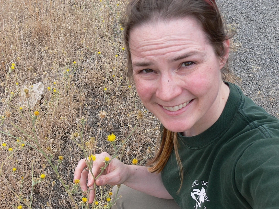 Image of Dr. Dlugosch in field. 